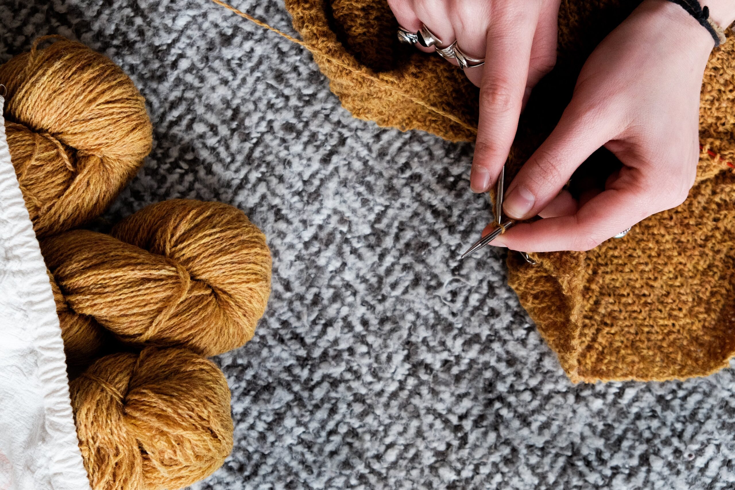 Hands reweaving garment