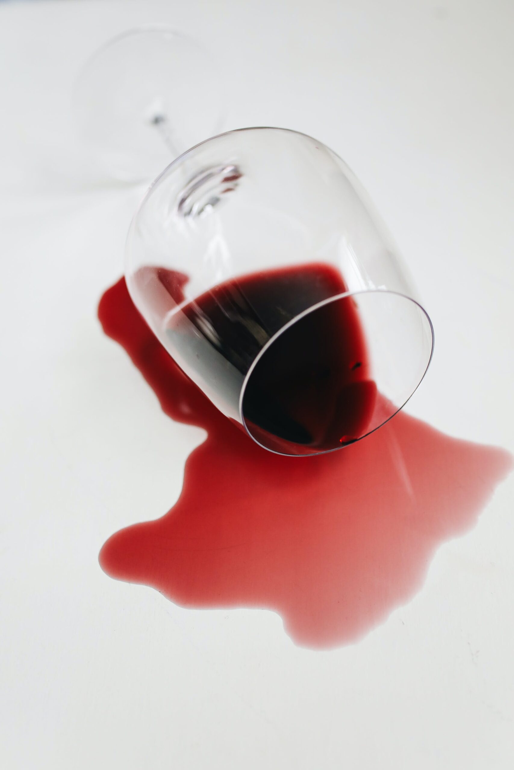 Spilled glass of red wine