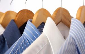 row of business shirts on hangers