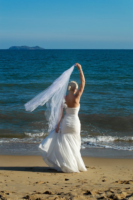 woman at beach in wedding dress